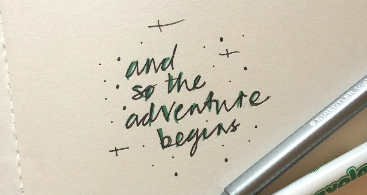 white and blue click pen on white paper